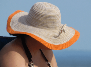 woman in wide-brimmed beach hat